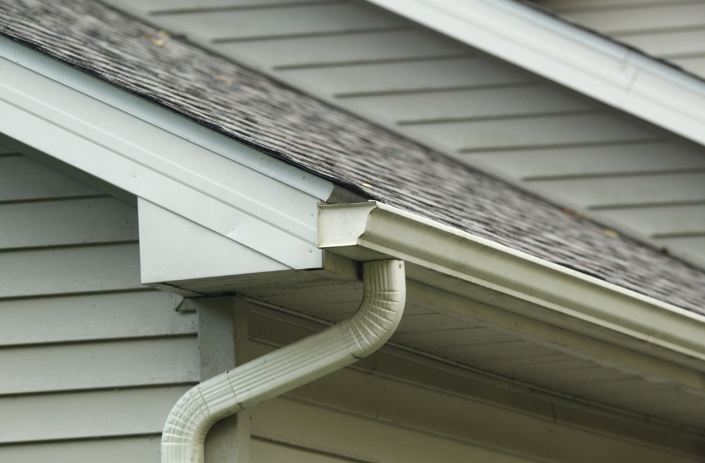 Closeup of roofing and gutters on a New England home.