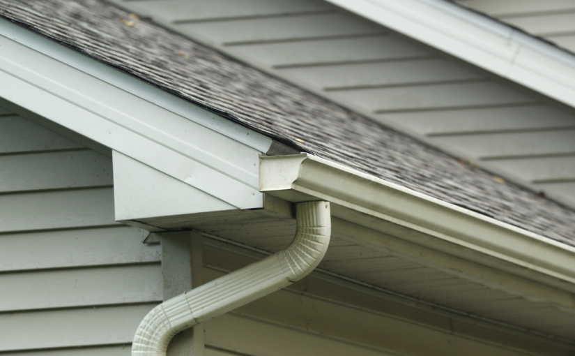 Closeup of roofing and gutters on a New England home.